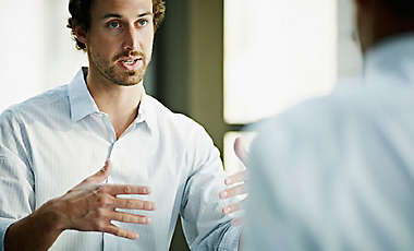 Businessman in discussion with coworker in office