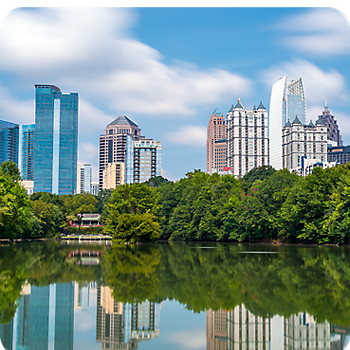 View of reflection of trees and buildings over the lake