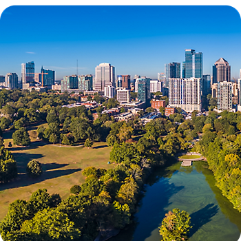 City skyline with a park and river upfront