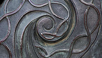 Bronze metal spiral pattern