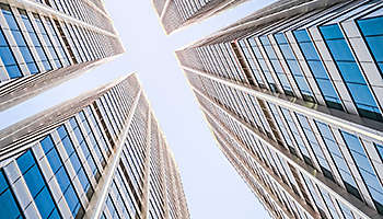 Looking up at two buildings