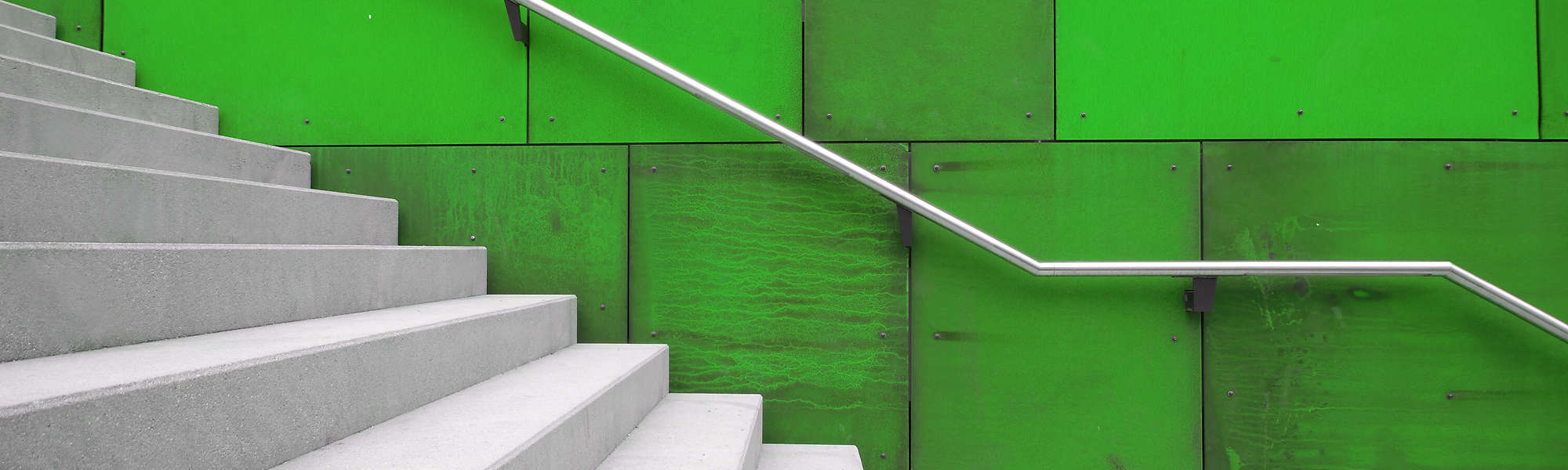 White staircase with green wall
