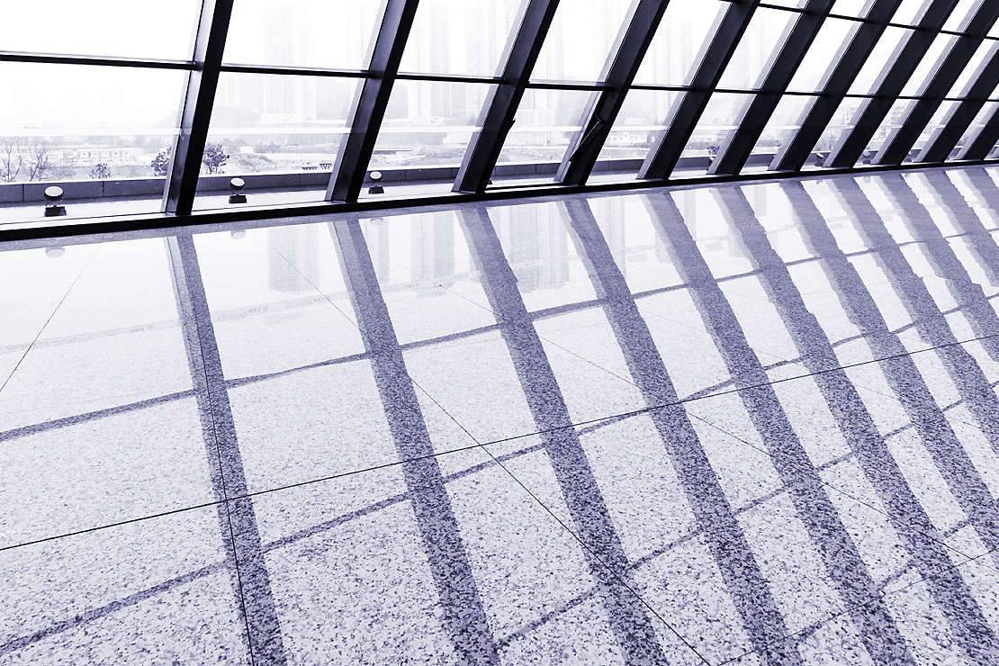 Windows reflecting off tiled floor
