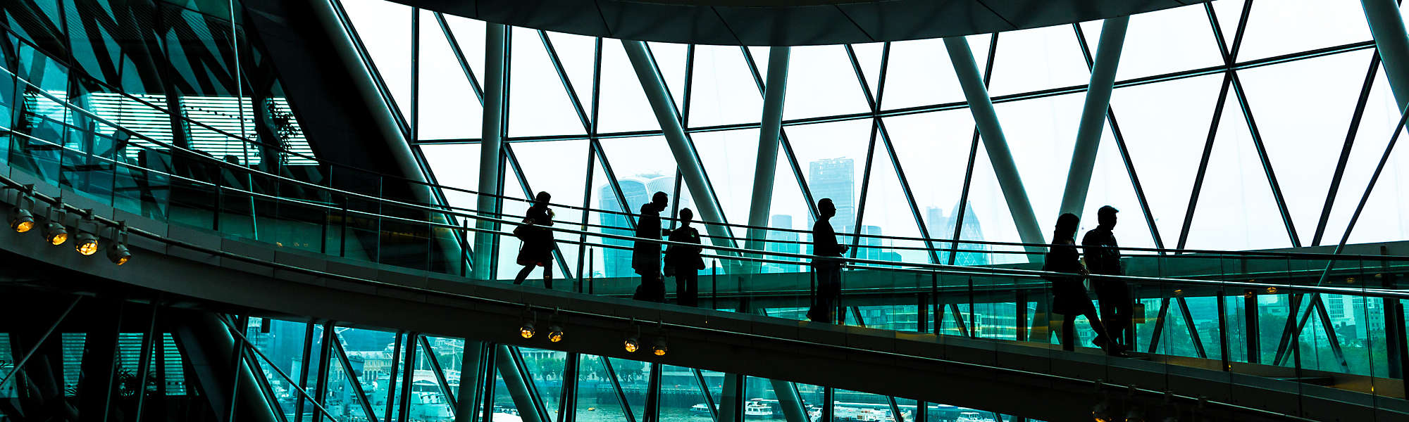 Abstract modern architecture and silhouettes of people on spiral staircase London England