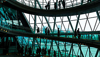 Abstract modern architecture and silhouettes of people on spiral staircase London England