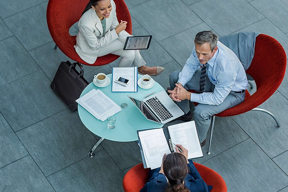 Three people in a discussion